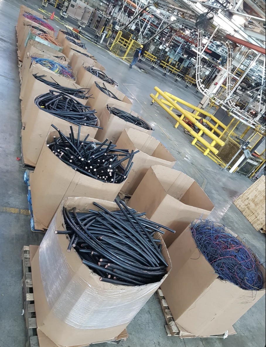Pallets of insulated copper scrap wire ready for pickup — paid at stripped prices